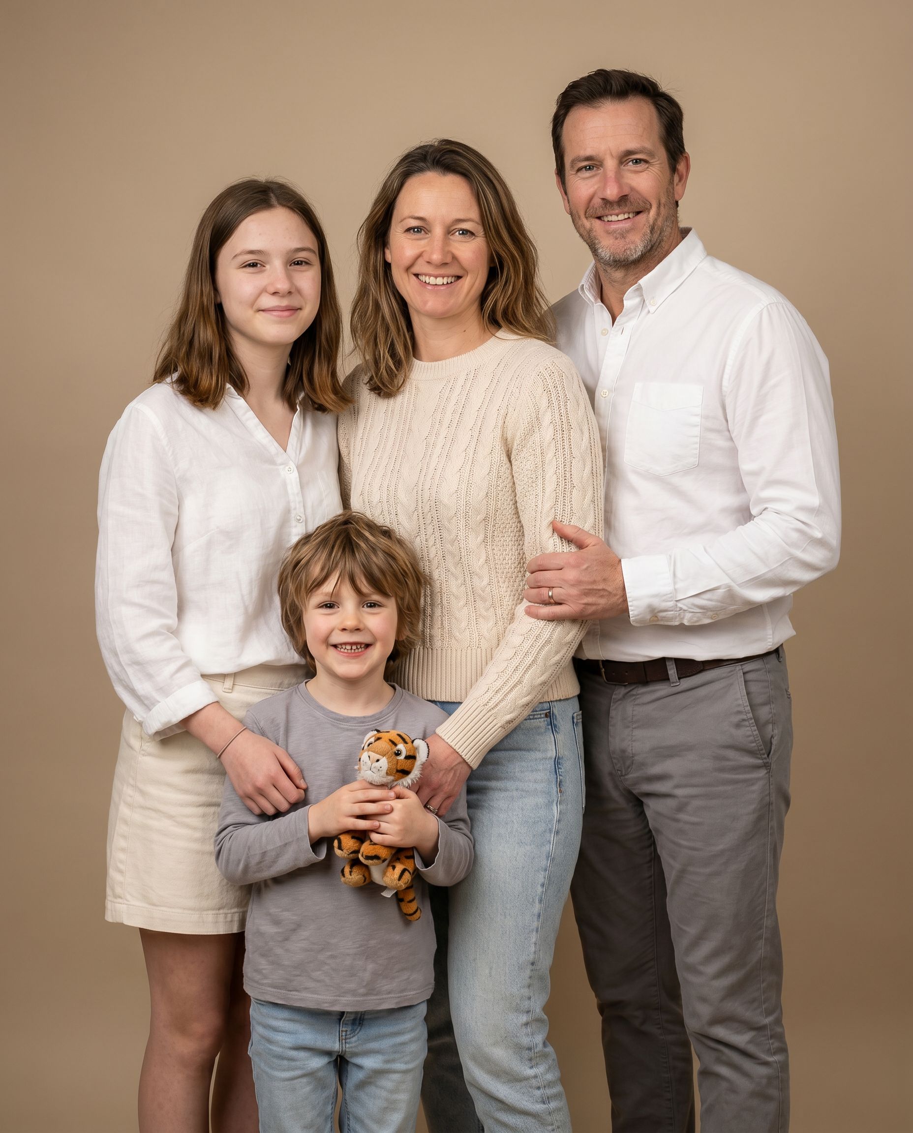 AI family photoshoot studio portrait in soft neutrals
